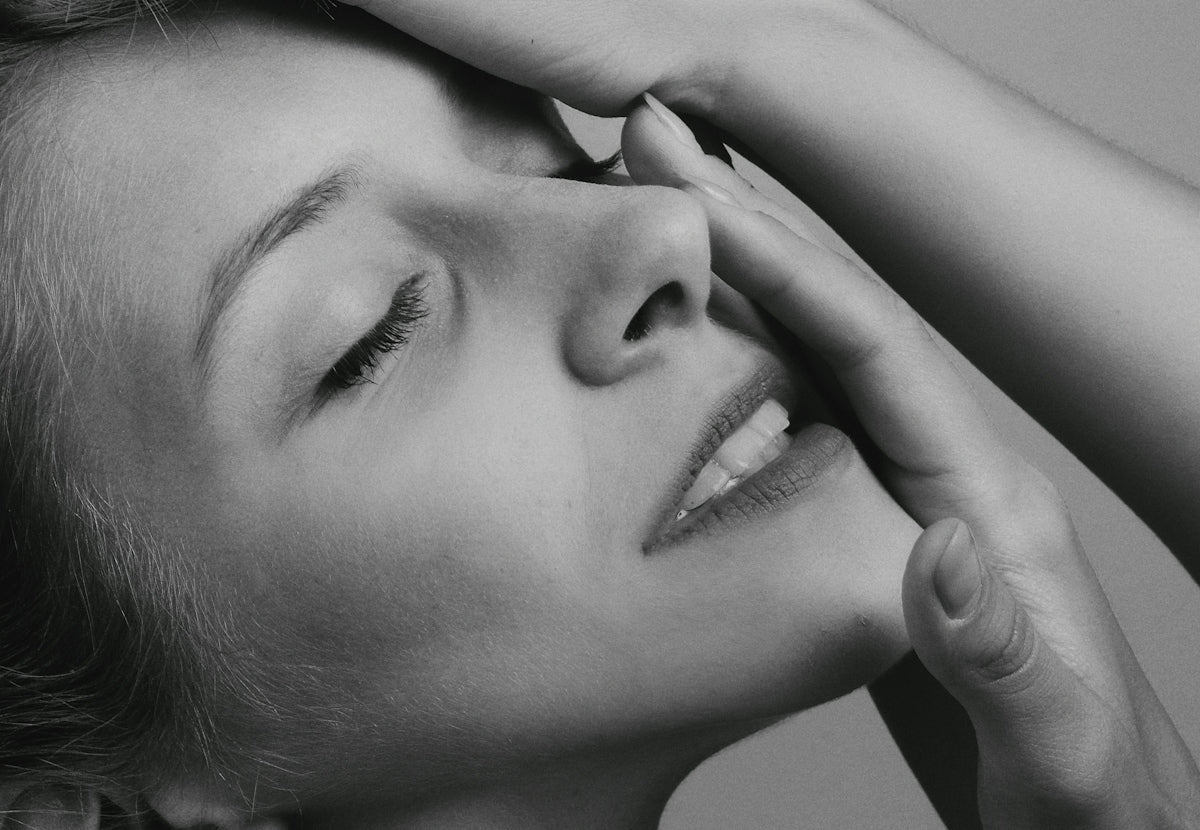 grayscale photo of womans face