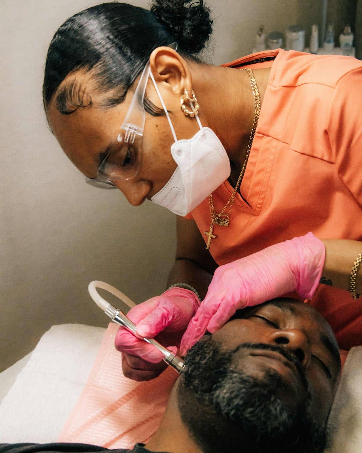 a man getting his teeth checked by a dentist