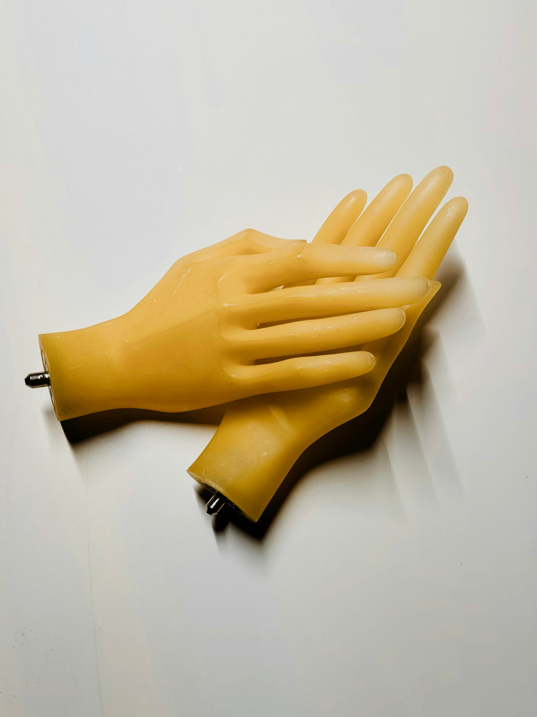 A pair of yellow gloves sitting on top of a table