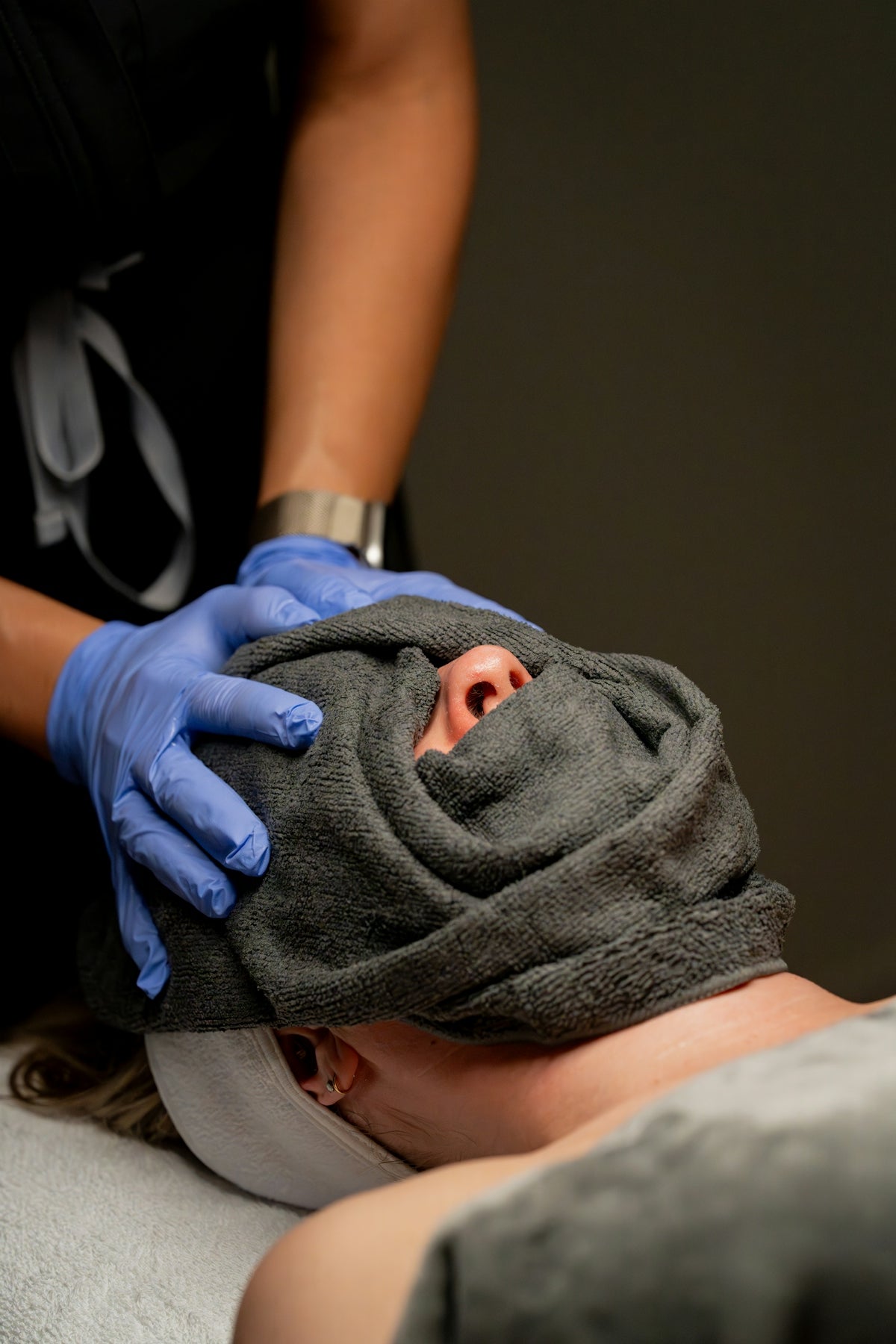 Spa treatment with a towel covering the face